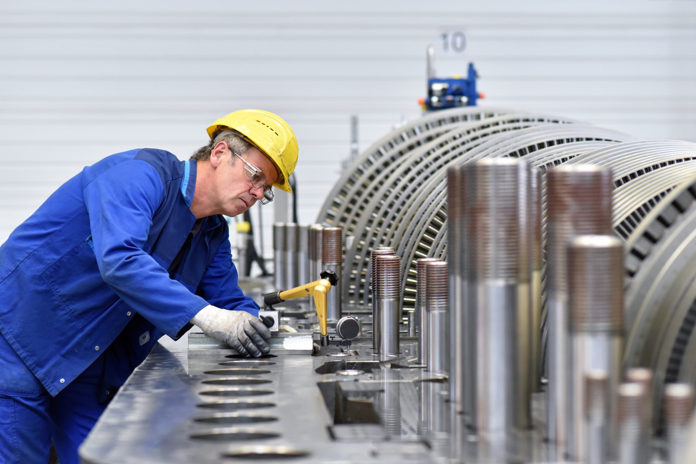 Technician inspecting a gas turbine component